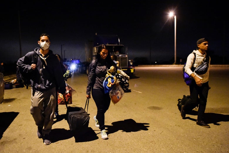 Venezuelan migrants cross the border between Ecuador and Peru in Tumbes, Peru, on August 25, 2018.
